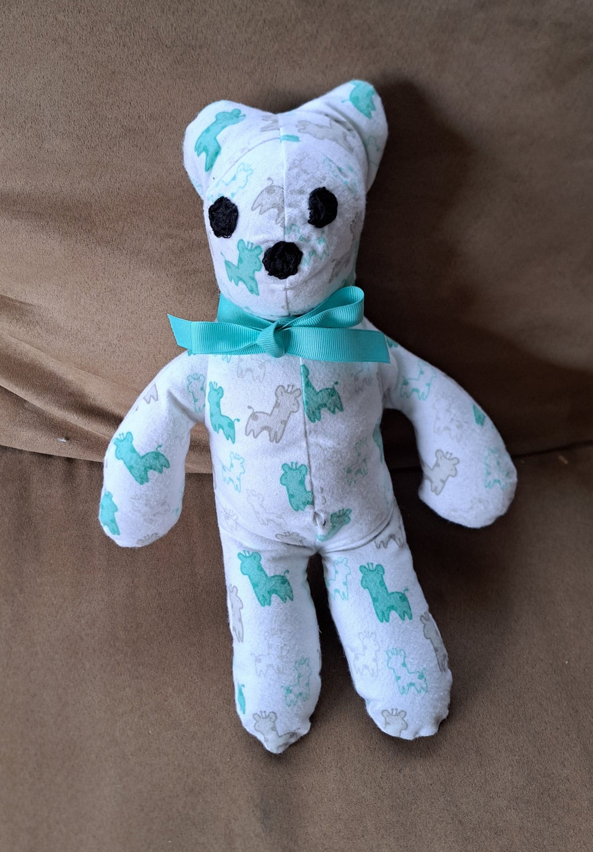 Handcrafted stuffed 14-inch-tall white flannel bear with little giraffe print, embroidered eyes & nose, safe for al ages