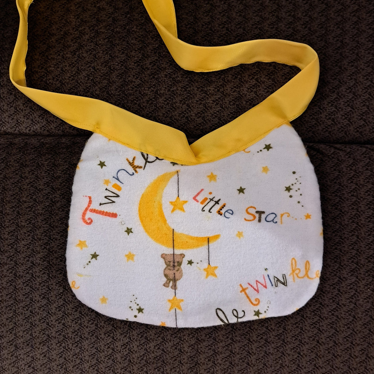 6"x6" white Twinkle Star pattern flannel baby bib with yellow silky ties