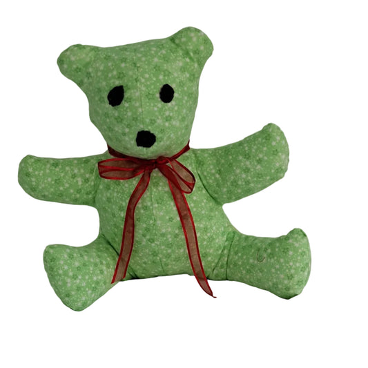 Flannel stuffed sitting teddy with arms outstretch to 17", green background with tiny white stars, embroidered eyes & nose, safe for all ages, red bow readdy for Christmas