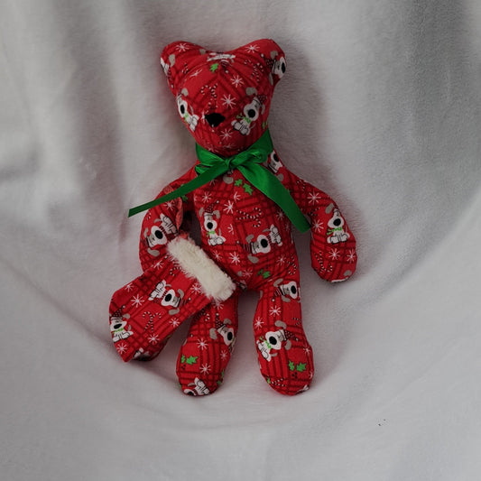 14"tall x 10"wide bear, flannel 
Snoopy Dog Christmas pattern, embroidered nose eyes are part of pattern, He comes with his own little stocking made with same flannel pattern & top with white fur.