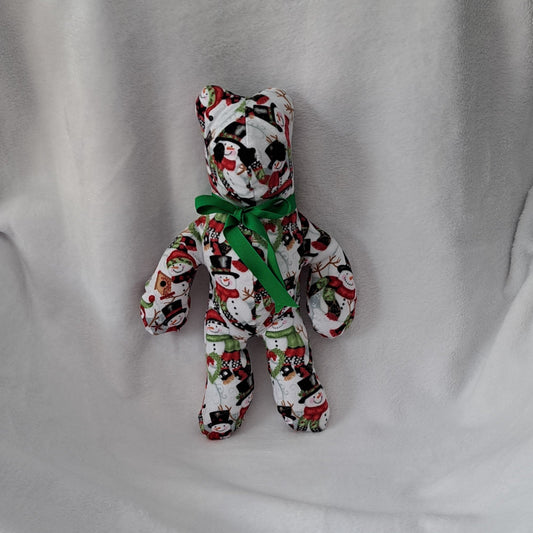 14"tall x10"wide bear designed with Christmas snowman pattern flannel, embroidered eyes & nose, safe for all ags