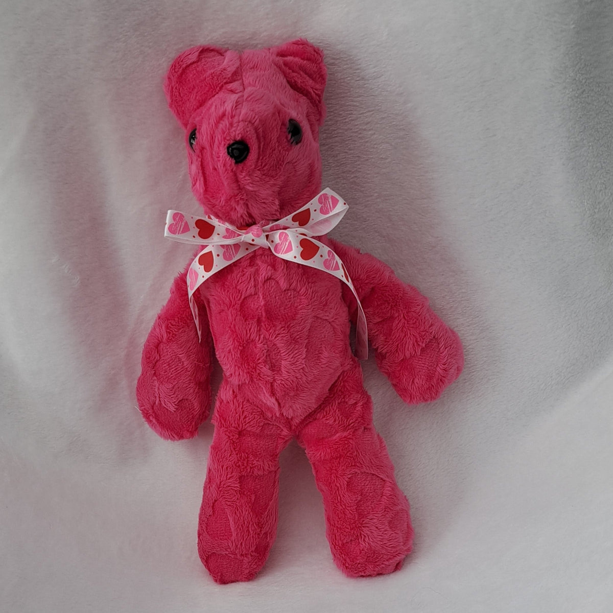 Stuffed embossed hearts pink bear, 14" tall x 10" across. plastic eyes & nose, 3+years
