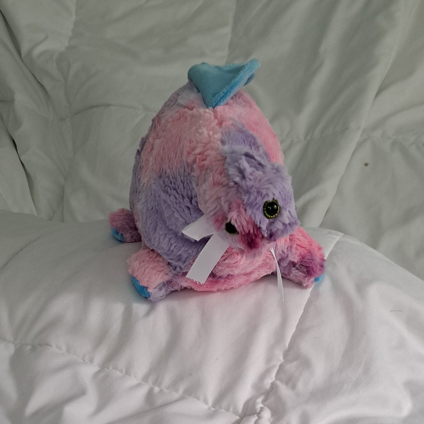 27"long shaggy tie dye (pink, blue. lavender & purple) Dino with a blue minky crest, plastic eyes making it suitsble for 3+ ages