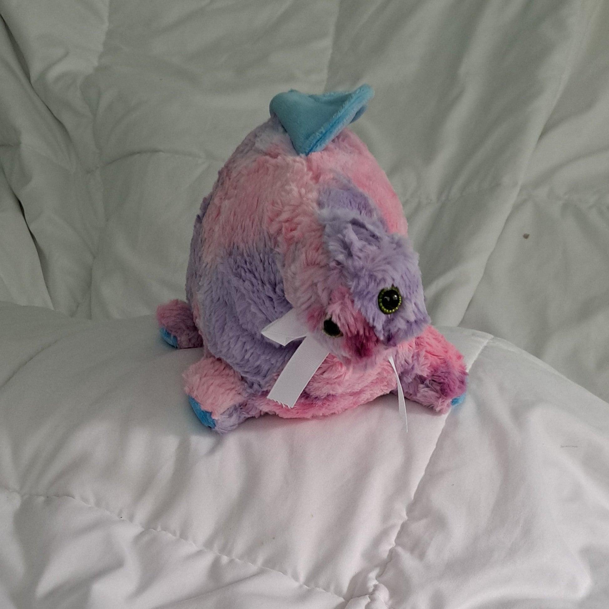 27"long shaggy tie dye (pink, blue. lavender & purple) Dino with a blue minky crest, plastic eyes making it suitsble for 3+ ages