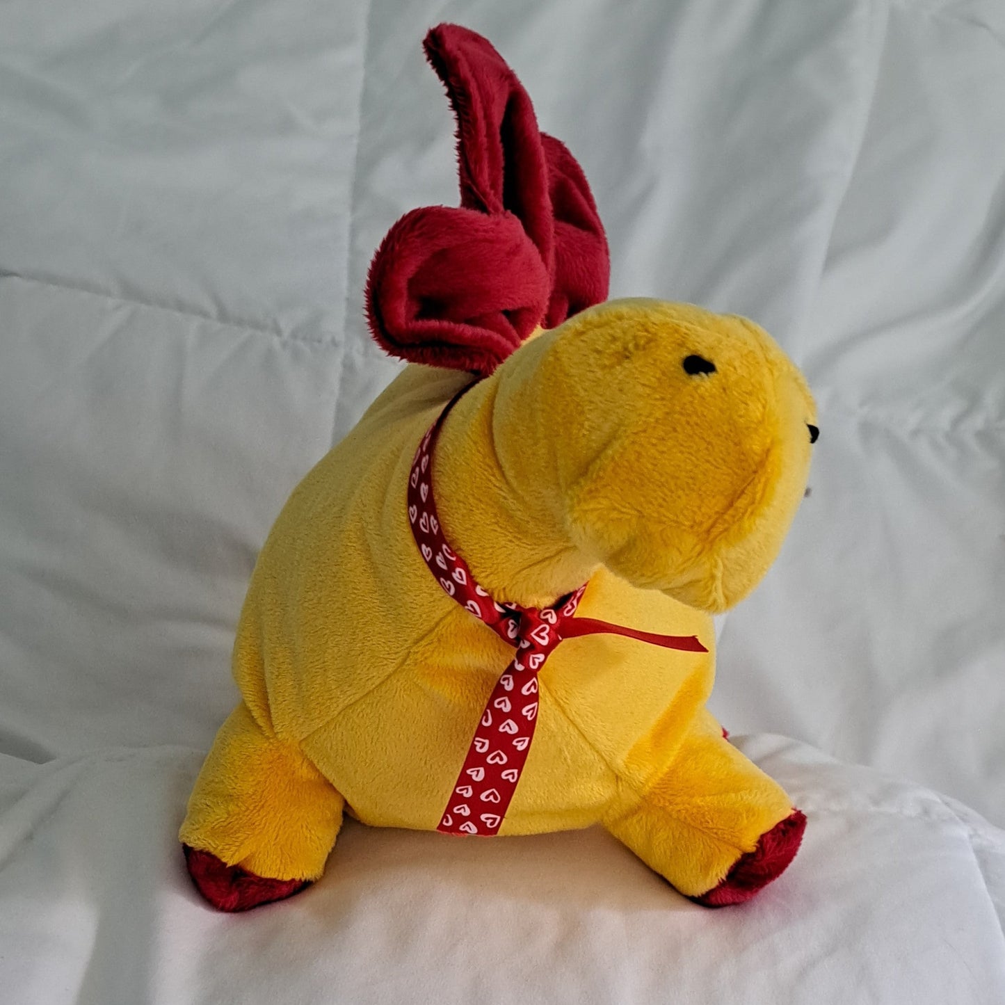 27" yellow minky plush dino with red crest, hand embroidered eyes, safe for all ages.
