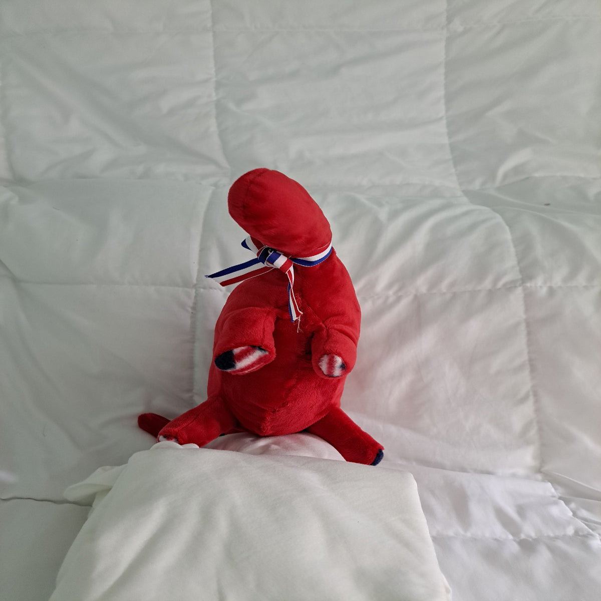 18" Long red minky plush dino with patriotic crest, paw pads , safe for al ages