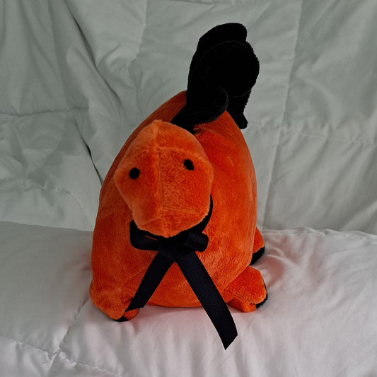 Orange minky plush 7" long dino with black cresy, embroidered eyes is safe for all ages