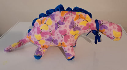 18-inch-long light lilac butterfly flannel dino with blue crest, baby safe