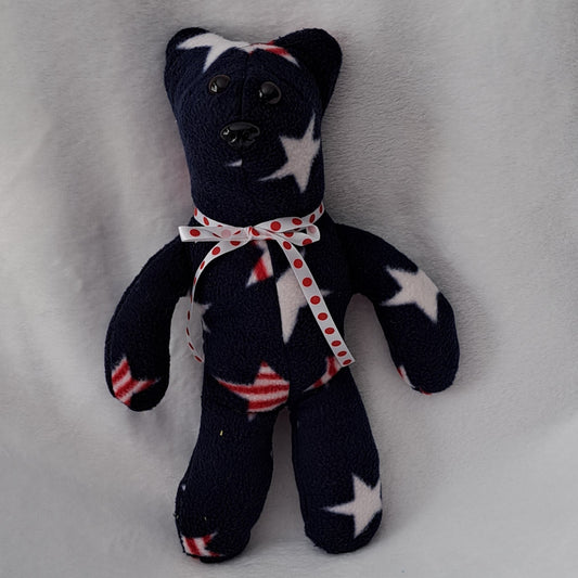 stuffed navy fleece with stars & stripes 14"tall x 10" across, plastic eyes & nose, ages 3+ years